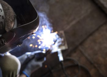 male-mechanic-working-his-workshop